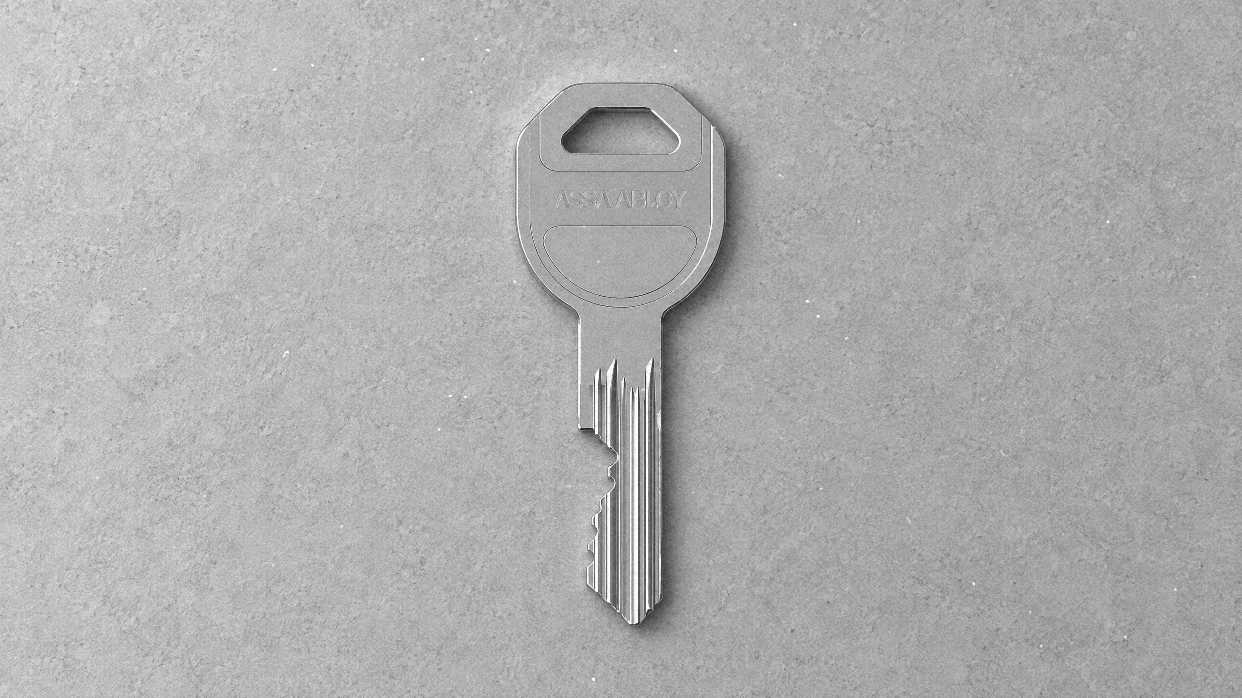 Standardowy klucz ASSA ABLOY LSTD na jasnym tle